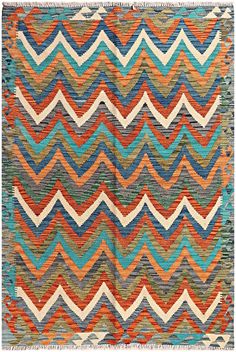 a multicolored rug with wavy lines on the front and back of it,