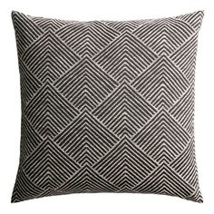 a black and white pillow on a white background