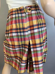 Vintage 80s yellow and blue preppy girl plaid skort in excellent condition size medium Waist 28 inches Hip 36 Waist to hem 21 inches Retro Fitted School Bottoms, Retro Fitted Bottoms For School, Fitted Retro Bottoms For School, Preppy Fitted Cotton Shorts, Yellow Cotton Bottoms For School, Multicolor Short Bottoms For School, Preppy Short Length Skort For Summer, Preppy Short-length Summer Skort, Preppy Cotton Short Skort