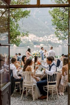 a group of people sitting around a dinner table