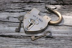 a couple of keys sitting on top of a lock