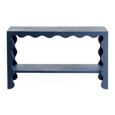 a blue shelf with scalloped edges on the top and bottom, against a white background