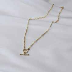 "14K Gold Toggle and Rolo chain necklace *The chain, toggle clasp and all components are 14K yellow gold (If you order a 16\" necklace, it will be a toggle clasp plus chain will be 16\".) The toggle clasp is about 12mm. 2.3mm Rolo chain Please read our policies before you place your order. https://www.etsy.com/shop/SashJewelry/policy?ref=shopinfo_policies_leftnav To see other Mother daughter necklace set click here: https://www.etsy.com/shop/SashJewelry?section_id=12441134&ref=shopsection_le Classic Gold Chain Link Toggle Necklace, Minimalist Yellow Gold Toggle Necklace For Everyday, Minimalist Oval Link Toggle Necklace With Cable Chain, Gold Minimalist Toggle Necklace With Cable Chain, Minimalist Toggle Necklace With Oval Link Cable Chain, Yellow Gold Toggle Necklace With Adjustable Chain, Everyday Gold Toggle Necklace With Cable Chain, Classic Yellow Gold Toggle Necklace With Gold Chain, Classic Everyday Toggle Necklace With Adjustable Chain