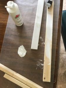 the table is being worked on with some wood and glue to make it look like they are