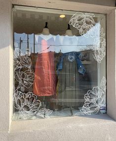 a window with clothes hanging in it