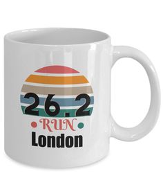 a white coffee mug with the words run london on it