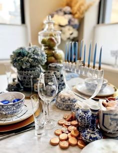 the table is set with blue and white dishes