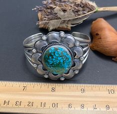 Handcrafted sterling silver Southwestern cuff bracelet with natural Kingman Turquoise, The bracelet's inner circumference measures 6" include opening and is adjustable to fit many wrist sizes. The top measure 1-7/8'' x 1-3/4''.  Signed GP. It's weights 61 grams. Our silver is genuine 925 sterling silver. You will receive the exact item in a gift box. Thanks for looking and check out more items in my Etsy shop for more great items and deals! https://www.etsy.com/shop/925usa Payment: We accept all Southwestern Style Round Cuff Bracelet As Gift, Adjustable Western Sterling Silver Bracelet For Gift, Turquoise Bracelet Cuff, Turquoise Cuff, Kingman Turquoise, New Mexico, Arm Band, Cuff Bracelet, Favorite Jewelry