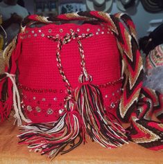 Beautiful red Wayuu shoulder bag.  Made by Indigenous of the Wayuu tribe in Colombia and embellished by our artisans to give them a touch of uniqueness. It can be used with a smart casual, or casual dress code.  Dimensions: W: 7' inches / 20 cm. L: 5'51 inches / 14 cm. Traditional Crochet Shoulder Bag For Daily Use, Traditional Crochet Shoulder Bag With Adjustable Strap, Red Woven Crochet Bag For Market, Traditional Handwoven Crossbody Bag, Red Bohemian Handmade Straw Bag, Handwoven Crochet Shoulder Bag For Festival, Traditional Shoulder Bag With Braided Handles, Festival Crochet Bag With Braided Handles, Traditional Crochet Tote Bag With Adjustable Strap