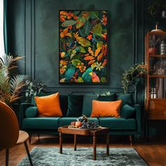 a living room with green walls and orange pillows on the couches in front of a painting