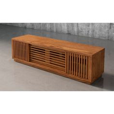 a large wooden cabinet sitting on top of a cement floor