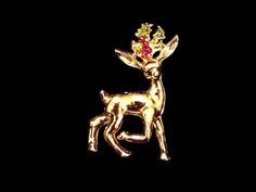 This is a beautiful vintage holiday pin in the shape of a reindeer, signed "Gerrys" on the back. It is about 1.5 inches tall and 1 inch wide. It is made of gold toned metal with red and green holly and berries as painted details. It is in great vintage condition. I do not know the true age of the item, but it is certainly vintage.  Gerrys made a wide variety of these Christmas brooches, and I am lucky to have quite a few of them - some of them multiples! I have 2 of these deer. This would make an excellent gift for wives, mothers, sisters, and friends! Also, a lovely addition to any jewelry collection, or your own holiday wardrobe! I obviously do not have a professional camera 😊  If you would like to see additional pictures of any item, or have other questions, please send me a message! I Christmas Holiday Brooch Jewelry, Gold Christmas Holiday Brooch, Vintage Gold Brooch With Bow, Vintage Swarovski Christmas Tree Brooch, Vintage Multi-stone Gold Brooches, Holiday Pins, Holiday Wardrobe, Christmas Gifts For Women, Christmas Jewelry