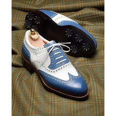 Elevate your shoe game with these bespoke leather handmade shoes. Made with genuine leather, these oxfords come in blue & white, and are available in all US, UK, EU, and AU sizes. The comfortable insole and standard shoe width make them perfect for any occasion. Designed with a solid pattern and lace-up closure, these handmade shoes are a vintage addition to any wardrobe. The leather outsole adds durability and longevity to these unique boots. Customize them to your liking with personalization options available. Get ready to step out in style with these one-of-a-kind handmade leather shoes. Blue Round Toe Oxfords With Goodyear Welted Sole, Blue Round Toe Oxfords With Goodyear Welt, Blue Oxfords With Goodyear Welted Round Toe, Blue Wingtip Leather Shoes With Rubber Heel Cap, Blue Oxfords With Contrast Sole And Round Toe, Blue Wingtip Oxfords With Rubber Sole, Classic Blue Wingtip Oxfords, Classic Blue Oxfords With Brogue Detailing, Classic Blue Dress Shoes With Brogue Detailing