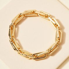 Stretch chain link cuff bracelet Approx: 8" Material: Gold plated Metal Chain Bracelet With Rectangular Links, Gold-tone Chain Link Bracelets, Metal Bracelets With Rectangular Chain Links, Metal Paperclip Bracelet With Chunky Chain Link, Gold Chunky Chain Link Bracelet, Metal Chain Link Bracelets, Metal Chain Cuff Bangle, Metal Bangle Chain Bracelet With Solid Link, Gold Metal Bracelets With Chain Strap