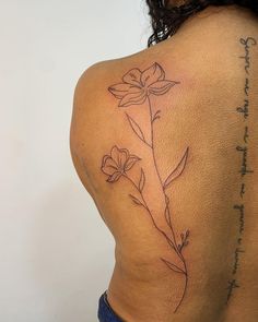 a woman with a tattoo on her back