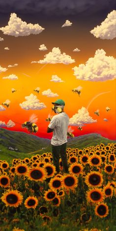 a man standing in the middle of a field of sunflowers under a colorful sky