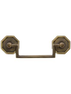 an antique brass finish bathroom towel bar with two handles and knobs on each end