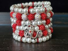 "This is One Beaded Bracelet that wraps around the wrist up to 6 times. This beautifully hand strung Red and White beaded Memory Wire Bracelet. Red and White Stackable Wrap Bracelet, is made White Glass Pearls (8MM) and Red and White micro pave beads(10mm) and features a Silver Elephant that adds elegance, strung onto six coils of silver memory wire. This bracelet stack can go from dressy to casual with many different colored outfits. View all Red and White Bracelets: https://www.etsy.com/shop/F Red Wrap Bracelet With Round Beads, Red Hand Wrapped Wrap Bracelet With Round Beads, Red Hand Wrapped Wrap Bracelet As Gift, Red Hand Wrapped Wrap Bracelet Gift, Gift Red Hand Wrapped Wrap Bracelet, Red Beaded Pearl Bracelet With Round Beads, Red Wrap Bracelet With Round Beads For Gift, Handmade Red Adjustable Pearl Bracelet, Red 8mm Beads Jewelry For Festive Occasion