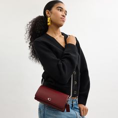 Form function and craftsmanship combine on our refined leather Evie Long Wallet. Detailed with our Signature hardware it has a convenient outside pocket and a spacious interior with multiple card slots a billfold compartment and a zip pocket for coins plus space for the largest size phone. Toss in a bag carry as a clutch or wear crossbody with the detachable gleaming chain strap. | Coach Evie Long Wallet With Chain - Women's Designer Crossbody - Silver/dark Ruby Wallet With Chain, Designer Crossbody, Signature Hardware, Wallet Chain, Long Wallet, A Bag, Chain Strap, Designing Women, Card Slots