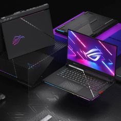 the asus rog laptop is on display in front of several other gaming accessories