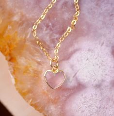 Looking for a unique accessory for some self love, or love for that special someone? Crafted from 14k gold filled and natural Rose Quartz, this pendant is the perfect, sparkling way to show anyone how much you care. Rose Quartz is a stone of love. It is believed to restore trust & harmony in relationships and encourage unconditional love. It purifies the heart and promotes self love, inner healing, and friendship. It is an alternate birthstone for January, as well as the spiritual birthstone for 14k Gold Filled Heart Shaped Rose Gold Jewelry, 14k Gold Filled Heart Jewelry Gift, Dainty 14k Gold Filled Jewelry For Valentine's Day, Dainty Birthstone Jewelry For Valentine's Day, Heart-shaped 14k Gold Filled Jewelry Gift, 14k Gold Filled Jewelry For Her Valentine's Day Gift, 14k Gold Filled Jewelry For Valentine's Day Gift, Elegant Healing Jewelry For Mother's Day, Delicate Pink Gold Jewelry For Gift