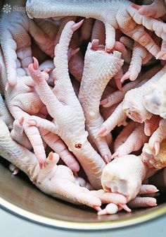 a bunch of baby chickens in a metal bowl