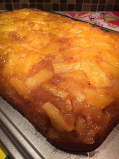 a pineapple upside down cake sitting on top of a pan