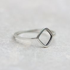 This sterling silver ring is a unique piece with an uncommon design and a gorgeous minimalistic look. If you love unusual jewelry, which you'll definitely won't see on anyone else, this Rhombus ring will become your best-loved one.The ring is 1 mm thick and is very sturdy although it looks very dainty on the finger.You see the ring of the 5.5 size in the pictures. You may order the ring of any size. If you are not sure about the size, this will be helpful: findmyringsize.com/If you want to buy t Simple Sterling Silver Open Diamond Ring, Minimalist Silver Diamond Ring With Simple Design, Minimalist Sterling Silver Diamond Ring With Open Band, Silver Minimalist Diamond Ring, Minimalist Silver Diamond Ring, Silver Stackable Open Ring With Single Diamond, Minimalist Silver Diamond Ring For Everyday, Silver Open Ring With Single Diamond, Minimalist Open Band Ring With Single Diamond