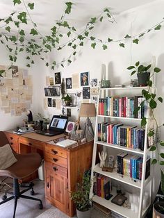 a home office with bookshelves and plants on the wall, along with a ladder