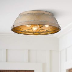 a light fixture hanging from the ceiling in a room