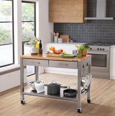 a kitchen island with pots and pans on it