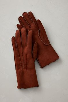 While these Spanish Merino gloves are designed to keep your hands toasty warm, they'll also accent your cold-weather wardrobe with chic sophistication. Expertly handcrafted from soft Merino , these gloves easily roll to form dramatic cuffs that can be adjusted for comfort or simply to add an eye-catching dimension to a captivating winter ensemble. Leather Belts For Women, Sheepskin Gloves, Gloves Women, Promo Gifts, Fur Accessories, Sheepskin Slippers, Sheepskin Coat, Wool Wrap, Sheepskin Rug