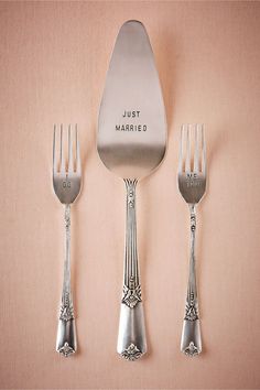 three forks, one knife and two spoons with the words just married written on them