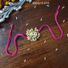 Exclusive Kundan Rakhi for Brother, Thread Pearl Bracelet, Celebrate Raksha Bandhan with Traditional Indian Rakhi, Rakhi Card (pack of 1) Length: Freesize Material: 100% cotton thread (soft thread) Package: pack of 1 Rakhi, also known as Raksha Bandhan, is a traditional Indian festival that celebrates the special bond between brothers and sisters. It is a joyous occasion where sisters tie a decorative thread called a rakhi around their brothers' wrists, symbolizing their love, protection, and th Motif Bracelets For Diwali Gift, Diwali Gift Bracelets With Motifs, Festive Motif Bracelets Perfect For Gifts, Festive Bracelets With Motifs For Gift, Festive Bracelets With Motifs As Gifts, Diwali Gift Bracelets With Latkans, Diwali Gift Bracelet With Latkans, Adjustable Meenakari Bracelet As Gift, Adjustable Bracelets For Navratri As A Gift