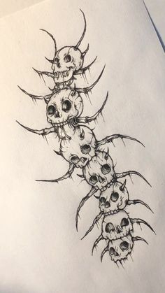 a drawing of five skulls with their heads turned upside down