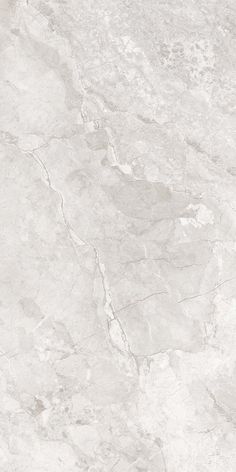 a white marble textured surface with grey veiners