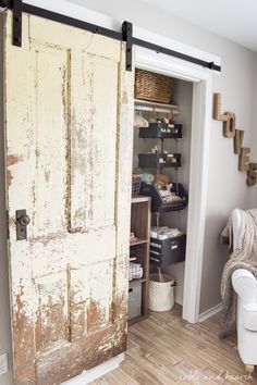 an old door is open to reveal the storage area