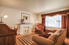 a living room filled with furniture and a fire place