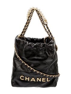 Chanel HoboFrom the Spring/Summer 2023 Collection by Virginie ViardBlack CalfskinGraphic PrintGold-Tone HardwareChain-Link Handle & Chain-Link Shoulder StrapCanvas Lining & Single Interior PocketDrawstring Closure at TopIncludes Dust Bag Spring Summer 2023, 2023 Collection, Hobo Handbags, Summer 2023, Chain Link, Dust Bag, Women Handbags, Chanel, Spring Summer