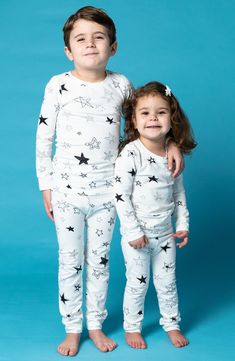 Sweet stars pattern these stretch-cotton pajamas with a longer-length top that means it won't ride up while baby is relaxing. This item is designed to fit snugly, as it is not flame-resistant 95% organic cotton, 5% spandex Machine wash, tumble dry Imported White Family Matching Tops For Loungewear, Star Print Long Sleeve Sleepwear For Pajama Party, White Family Matching Sleepwear For Pajama Party, Long Sleeve Sleepwear With Star Print For Bedtime, Playful White Onesie For Pajama Party, White Family Matching Sleepwear, Long Sleeve Sleepwear With Star Print, Long Sleeve Star Print Sleepwear, White Long Sleeve Tops For Sleepover