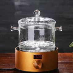 a glass jar on top of a wooden table