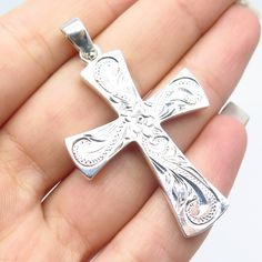 Great vintage condition. 925 Sterling Silver Vintage Ornate Floral Cross Pendant Weight: 7.7g WELCOME TO PAWN SHOP We are an actual pawn shop and have been in business for over 25 years. Since 1990, our establishment has been serving a variety of clients by providing them with short term cash solutions and options of liquidity regarding their treasured heirlooms. Acknowledging that today′s customers are very sophisticated and are looking for a variety of investments, our acquisitions are hand-pi Engraved Cross, Floral Cross, Pawn Shop, Unique Jewelry Designs, Cross Jewelry, Hand Engraving, 25 Years, Cross Pendant, Jewelry Necklace Pendant