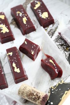 several pieces of chocolate sitting on top of wax paper