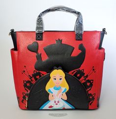 This is a Loungefly Disney Alice in Wonderland - Villains convertible crossbody bag.  This stunning bag is made with a durable faux leather that has a glitter red and solid black exterior.  It features a colorful Alice applique on the front pouch with embossed direction signs.  Around the pouch and on the sides pockets are silhouettes of the Queen of Hearts and her solders.  The bag can be carried by its faux leather handles, or over the shoulder with the detachable shoulder strap or worn as a b Embellished Clothes, Direction Signs, The Queen Of Hearts, Disney Alice In Wonderland, Convertible Crossbody Bag, Loungefly Disney, Disney Collectables, Disney Alice, Black Exterior