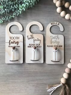 three wooden bottle openers with the words tooth fairy, tooth fairy and please stop here