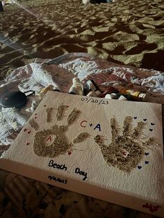 a hand and foot print on a bed