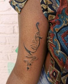 a woman with a tattoo on her arm