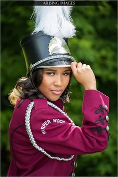 a woman wearing a hat with feathers on it