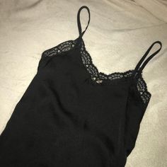 Never Worn Since It Isn’t My Size :( It’s Super Cute & Trendy Though, Make An Offer Id Say Fits A Small/Medium Best ( Depending On Bra Size) Black Satin Cami Top, Black Silk V-neck Camisole, Black Satin Camisole Top, Black Silk Camisole Top, Black Silk Camisole Chic Style, Black Satin Camisole With Lace Trim, Black Silk Camisole For Night Out, Chic Black Silk Camisole, Silk Tops With Lace Trim For Night Out