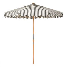 an umbrella that is sitting on top of a wooden pole with black and white stripes